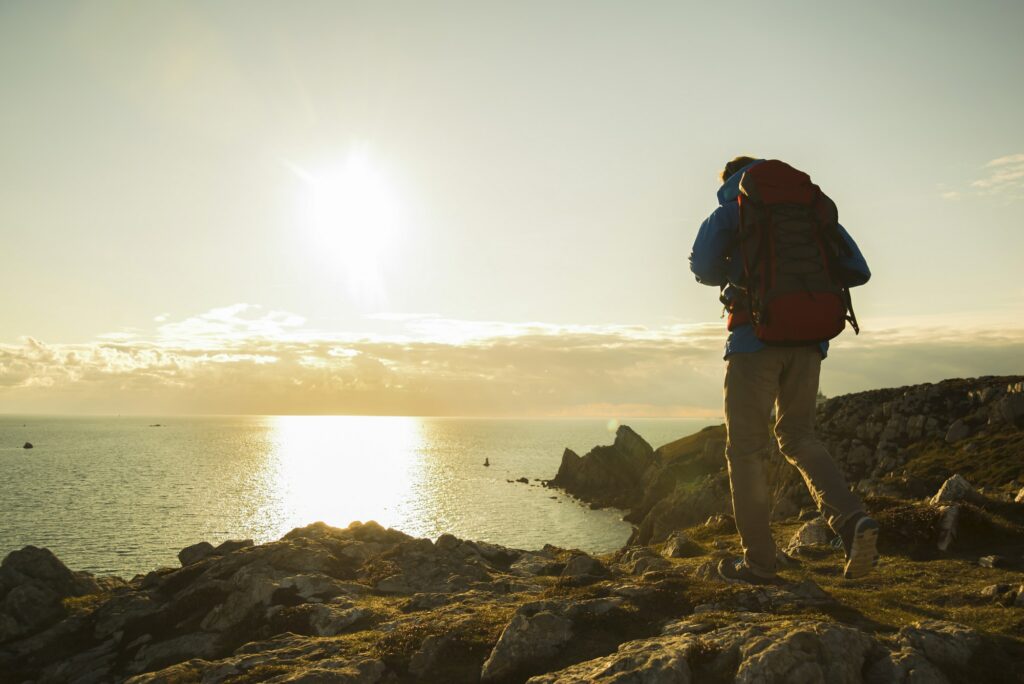 France, Bretagne, Camaret sur Mer, Mature man hiking at Atlanic coast